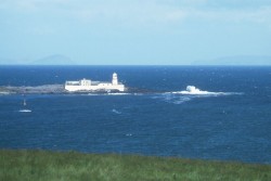 Lighthouse, deep blue sea and waves