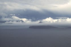 Koltur in cloud, with Streymoy behind