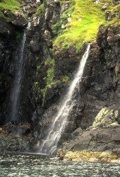 Water cascades down into the sea